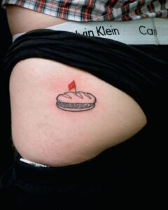 Minimalist Vietnamese banh mi tattoo representing Vietnam street food, travel memories, and local culture